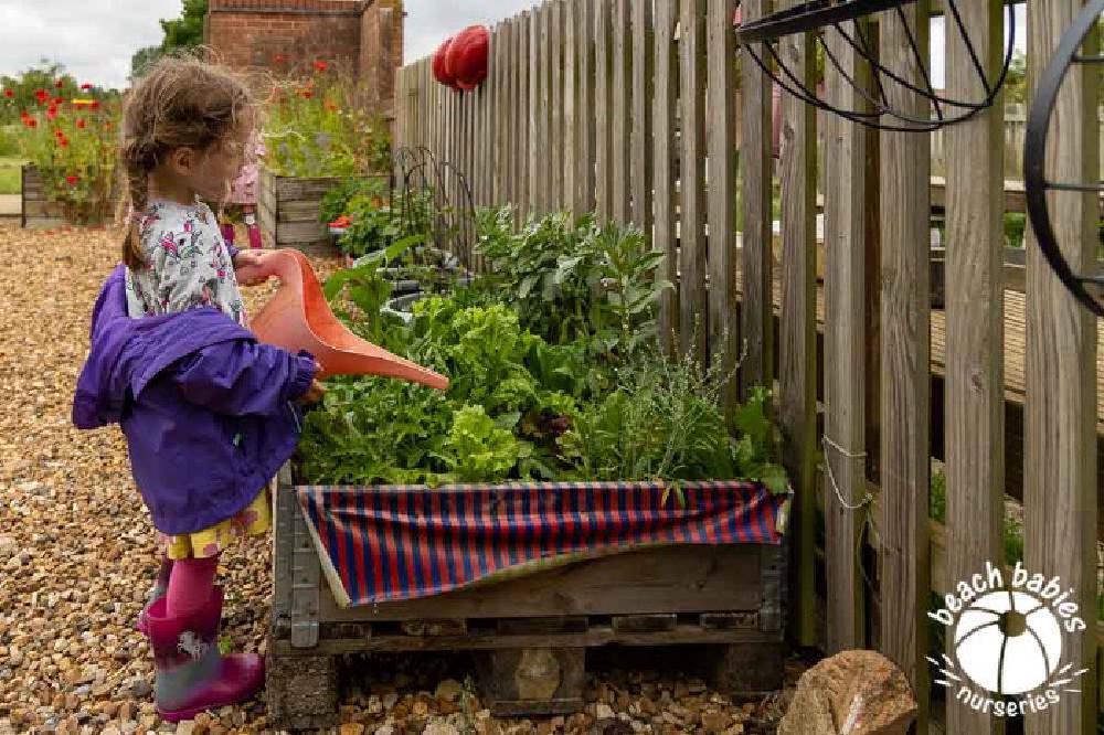 Children gardening outdoors at Beach Babies